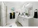 Bathroom showcasing a double vanity with marble countertop and eye catching octagon window at 507 Lakeshore Dr, Stockbridge, GA 30281