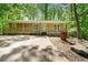 Ranch-style home featuring a cozy front porch and surrounded by mature trees at 507 Lakeshore Dr, Stockbridge, GA 30281