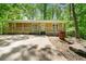 Charming home featuring a covered front porch, complemented by mature trees and landscaping at 507 Lakeshore Dr, Stockbridge, GA 30281