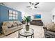 Bright living room features modern decor, including tiled floor and modern fixtures at 507 Lakeshore Dr, Stockbridge, GA 30281