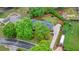 Aerial view of the home highlighting its roof, surrounding greenery, driveway, and backyard at 1405 Murdock Rd, Marietta, GA 30062