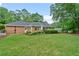 Expansive backyard with lush lawn, mature trees, and well-maintained landscaping offering a serene outdoor retreat at 1405 Murdock Rd, Marietta, GA 30062