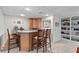 Finished basement bar area with seating, built-in shelving, and ample lighting at 1405 Murdock Rd, Marietta, GA 30062