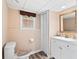 Neutral basement bathroom with modern fixtures, single sink vanity, and a toilet at 1405 Murdock Rd, Marietta, GA 30062