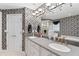 Elegant bathroom with double sinks, and decorative wallpaper at 1405 Murdock Rd, Marietta, GA 30062