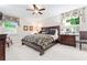 Spacious bedroom featuring a ceiling fan, neutral-toned walls, and abundant natural light at 1405 Murdock Rd, Marietta, GA 30062