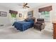 Bedroom features ceiling fan, two windows with shutters and a comfortable reading chair at 1405 Murdock Rd, Marietta, GA 30062