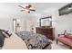 Bright bedroom featuring patterned bedding, hardwood dresser, and access to the ensuite bathroom at 1405 Murdock Rd, Marietta, GA 30062