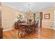 Elegant dining room with hardwood floors, chandelier lighting and seating for six at 1405 Murdock Rd, Marietta, GA 30062