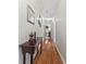 Hallway with hardwood flooring leads to other rooms, showcasing the home's layout at 1405 Murdock Rd, Marietta, GA 30062