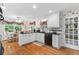 Bright kitchen with white cabinets, granite countertops, stainless steel appliances, and hardwood floors at 1405 Murdock Rd, Marietta, GA 30062