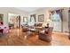 Spacious living room with hardwood floors, elegant furnishings and natural light from shuttered windows at 1405 Murdock Rd, Marietta, GA 30062