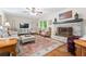 Cozy living room with hardwood floors, a brick fireplace, and comfortable seating at 1405 Murdock Rd, Marietta, GA 30062
