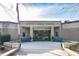 The front of Dodgen Middle School, featuring a brick exterior, entrance, blue benches, and American flag at 1405 Murdock Rd, Marietta, GA 30062