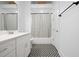 Stylish bathroom featuring a modern vanity and patterned floor at 160 Fowler St # 100, Woodstock, GA 30188