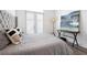 Bedroom with wood floors, tufted headboard, and natural light at 160 Fowler St # 100, Woodstock, GA 30188