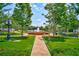 Scenic park view featuring a beautiful fountain, lush greenery and inviting benches at 160 Fowler St # 100, Woodstock, GA 30188