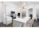 Well-appointed kitchen featuring stainless steel appliances, white cabinets, and island seating at 160 Fowler St # 100, Woodstock, GA 30188