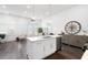 An open-concept home area with stainless steel appliances, dining, and seating at 160 Fowler St # 100, Woodstock, GA 30188