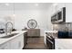 Contemporary kitchen with an island and lots of seating and stainless steel appliances at 160 Fowler St # 100, Woodstock, GA 30188