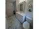 Modern bathroom with vanity, and walk-in shower with white marble tile surround at 1939 Suwanee Valley Rd, Lawrenceville, GA 30043
