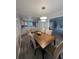 Charming dining area with hardwood floors, and an open view to the kitchen and staircase at 1939 Suwanee Valley Rd, Lawrenceville, GA 30043