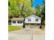 Charming two-story home with white siding, stone accents, and a well-manicured front yard at 1939 Suwanee Valley Rd, Lawrenceville, GA 30043