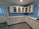 Updated kitchen with white cabinetry, light countertops, and modern appliances at 1939 Suwanee Valley Rd, Lawrenceville, GA 30043