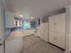 Spacious kitchen with white cabinets, modern appliances, and blue tiled backsplash at 1939 Suwanee Valley Rd, Lawrenceville, GA 30043