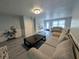 Inviting living room with modern floors, neutral colors, and cozy seating arrangement at 1939 Suwanee Valley Rd, Lawrenceville, GA 30043