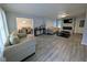 Bright living room featuring modern flooring, a stone fireplace, and comfortable seating at 1939 Suwanee Valley Rd, Lawrenceville, GA 30043