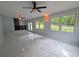 Airy sunroom with white marble tile, bright windows, and two ceiling fans at 1939 Suwanee Valley Rd, Lawrenceville, GA 30043