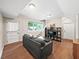 Finished basement featuring hardwood floors, a comfortable seating area, and ample natural light at 2178 Tanglewood Rd, Decatur, GA 30033