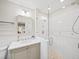 Elegant bathroom showcasing a glass-enclosed shower, a marble vanity, and contemporary fixtures at 2178 Tanglewood Rd, Decatur, GA 30033