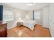 Comfortable bedroom featuring hardwood floors, large windows, and ample closet space at 2178 Tanglewood Rd, Decatur, GA 30033