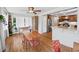 Cozy dining area open to the kitchen, featuring hardwood floors and stylish décor at 2178 Tanglewood Rd, Decatur, GA 30033