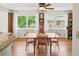 Bright dining area with brick accent wall, large windows, and stylish furnishings at 2178 Tanglewood Rd, Decatur, GA 30033