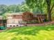 Beautiful brick home with a spacious backyard, large trees, and a charming covered deck at 2178 Tanglewood Rd, Decatur, GA 30033