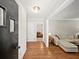 Inviting foyer with hardwood floors leads to a living room with a comfortable couch at 2178 Tanglewood Rd, Decatur, GA 30033