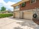 Spacious two-car garage with stone accents and ample driveway space at 2178 Tanglewood Rd, Decatur, GA 30033
