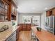 Spacious kitchen featuring stainless steel appliances, custom cabinetry, and an attached dining area at 2178 Tanglewood Rd, Decatur, GA 30033