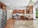 Bright and spacious kitchen with stainless steel appliances, custom cabinets, and a functional island at 2178 Tanglewood Rd, Decatur, GA 30033