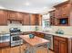 Well-equipped kitchen with stainless steel appliances, custom cabinets, granite countertops, and a functional island at 2178 Tanglewood Rd, Decatur, GA 30033
