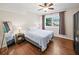 Cozy bedroom with natural light, wooden floors, a ceiling fan, and wardrobe at 2178 Tanglewood Rd, Decatur, GA 30033