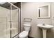Bathroom featuring a shower, toilet, and pedestal sink at 349 Harris Loop, Dallas, GA 30157