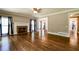Elegant living room with fireplace and hardwood floors with views into other rooms at 349 Harris Loop, Dallas, GA 30157