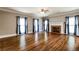 Bright living room with hardwood floors, fireplace, and large windows with stylish curtains at 349 Harris Loop, Dallas, GA 30157