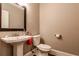Bathroom with pedestal sink and neutral wall color at 349 Harris Loop, Dallas, GA 30157
