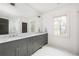 Elegant bathroom with a double vanity, marble countertops, and stylish fixtures at 134 Woodlawn Ave, Decatur, GA 30030
