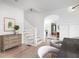 Open-concept dining room with hardwood floors, modern chandelier, and view of staircase and living room at 134 Woodlawn Ave, Decatur, GA 30030